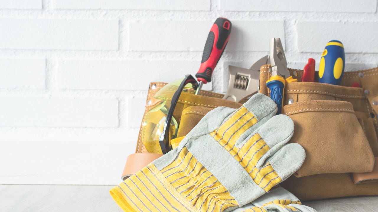 maintenance workers utility belt and work gloves