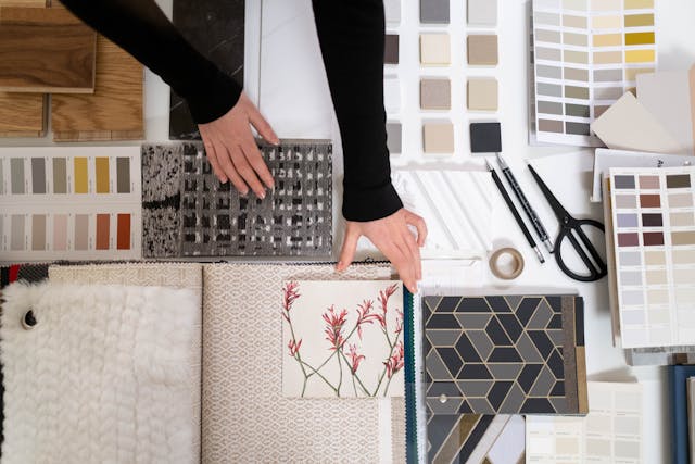 a person looking over a bunch of interior design elements