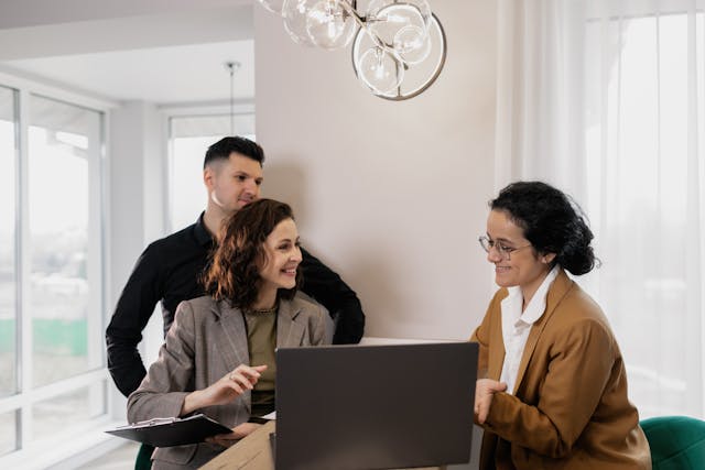a property manager speaking with two people