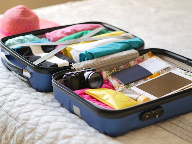 a piece of luggage with clothing in it