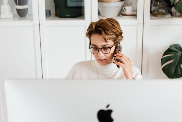 a property manager taking a call at their desk